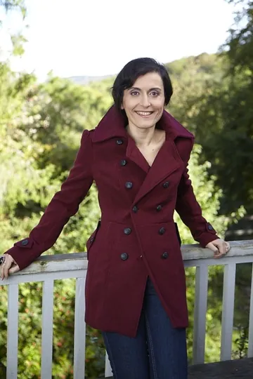 Julia F. Clifford outdoors in a burgundy coat